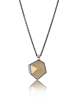 This oxidized sterling silver and richly textured 18k bimetal pendant is flush set with ideal cut white diamonds.  Accent facet glitters with the texture of diamond facets, individually scored and textured. Small size. Available in three oxidized sterling bail options, ID 3.25mm (pictured), fixed elongated, or elongated enhancer bail.