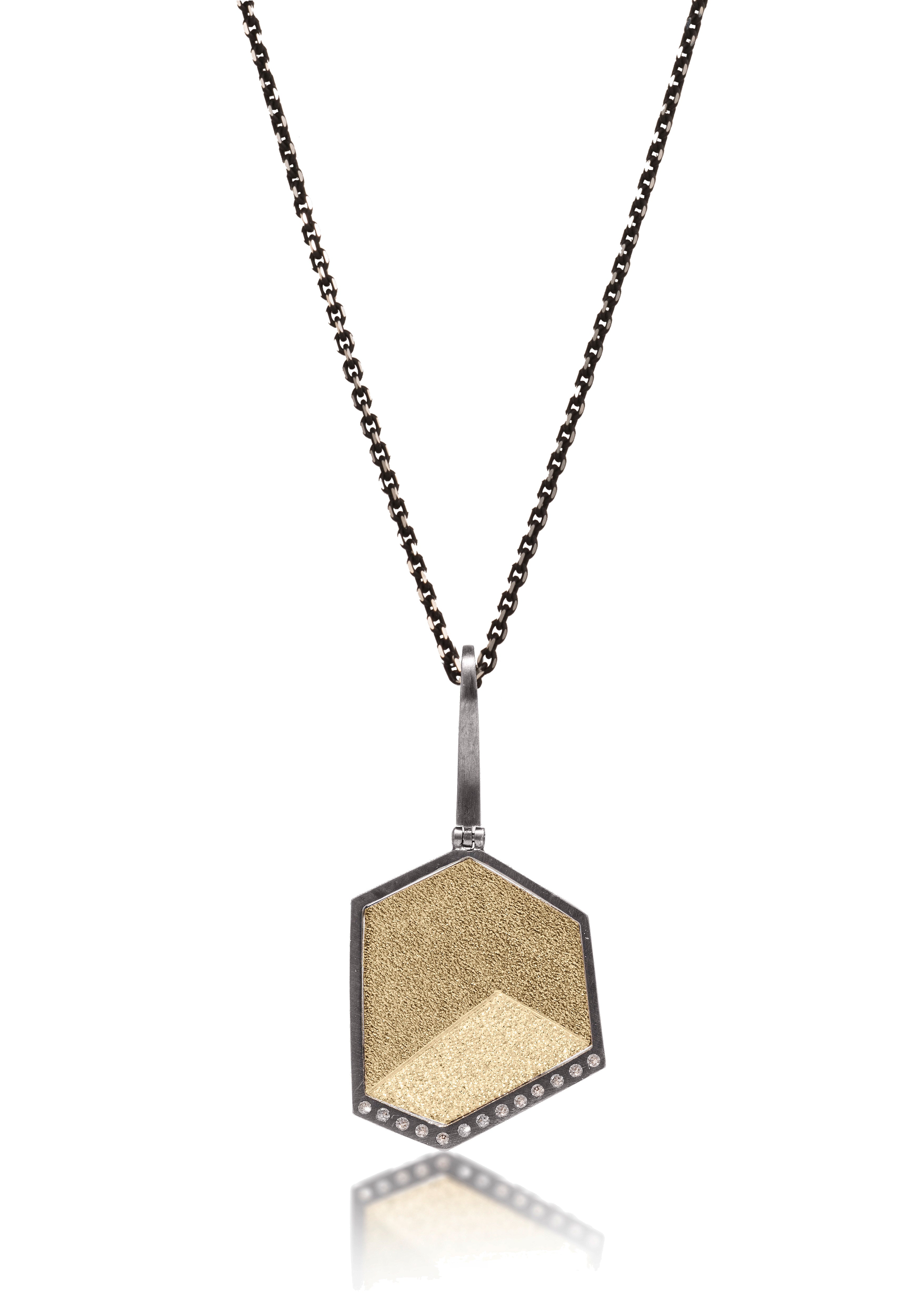 This oxidized sterling silver and richly textured 18k bimetal pendant is flush set with ideal cut white diamonds.  Accent facet glitters with the texture of diamond facets, individually scored and textured. Small medium. Available in oxidized sterling bail, ID 3.25mm, fixed elongated or elongated enhancer styles.  0.0621 tcw