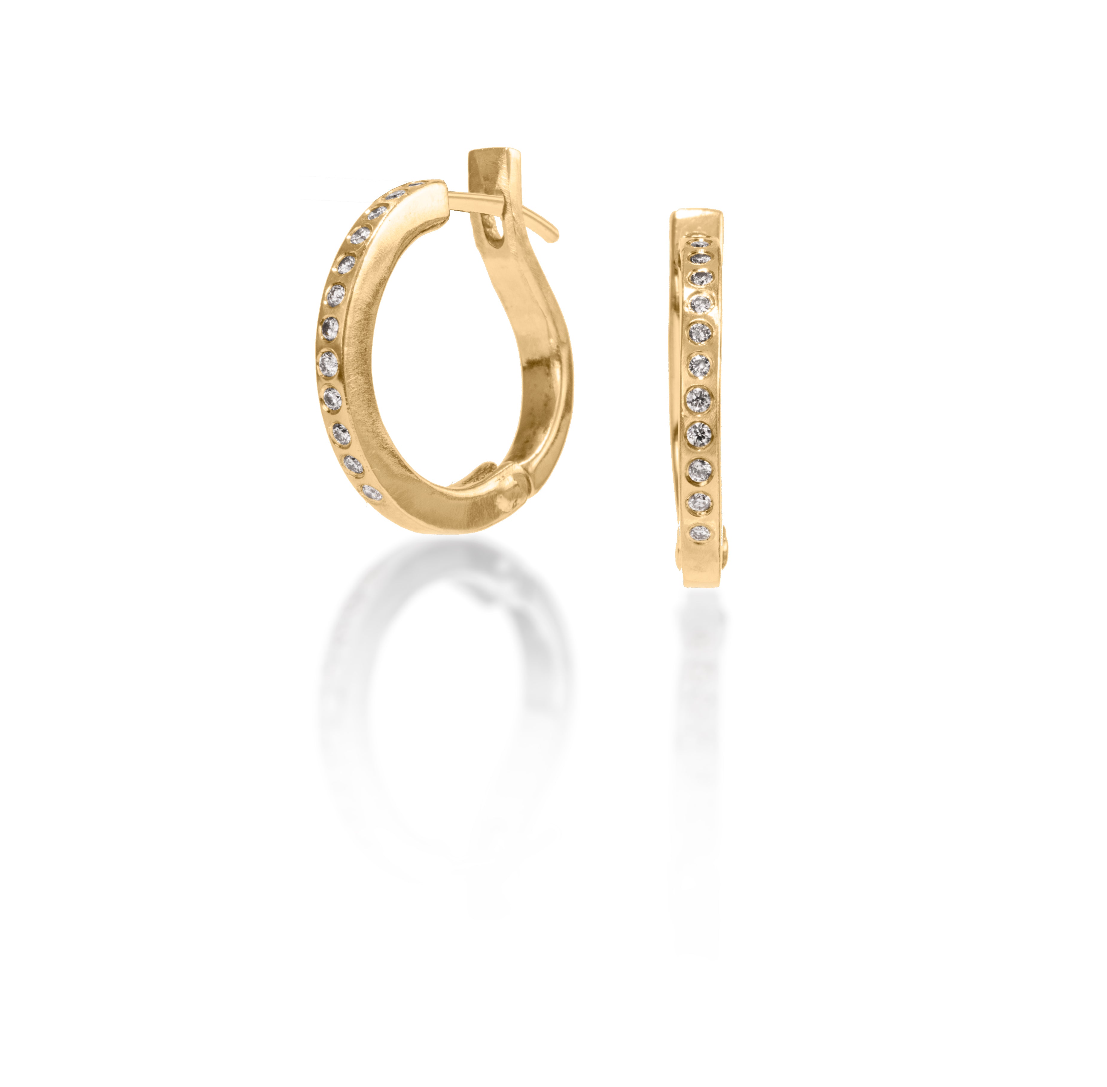 These simple, but elegant hoops are great on their own or accented with gem as a drop earring.  They feature white diamonds, 0.1656 tcw., and a built in closure that snaps securely closed.  Available in four color ways, oxidized silver, 18k gold, palladium or platinum.