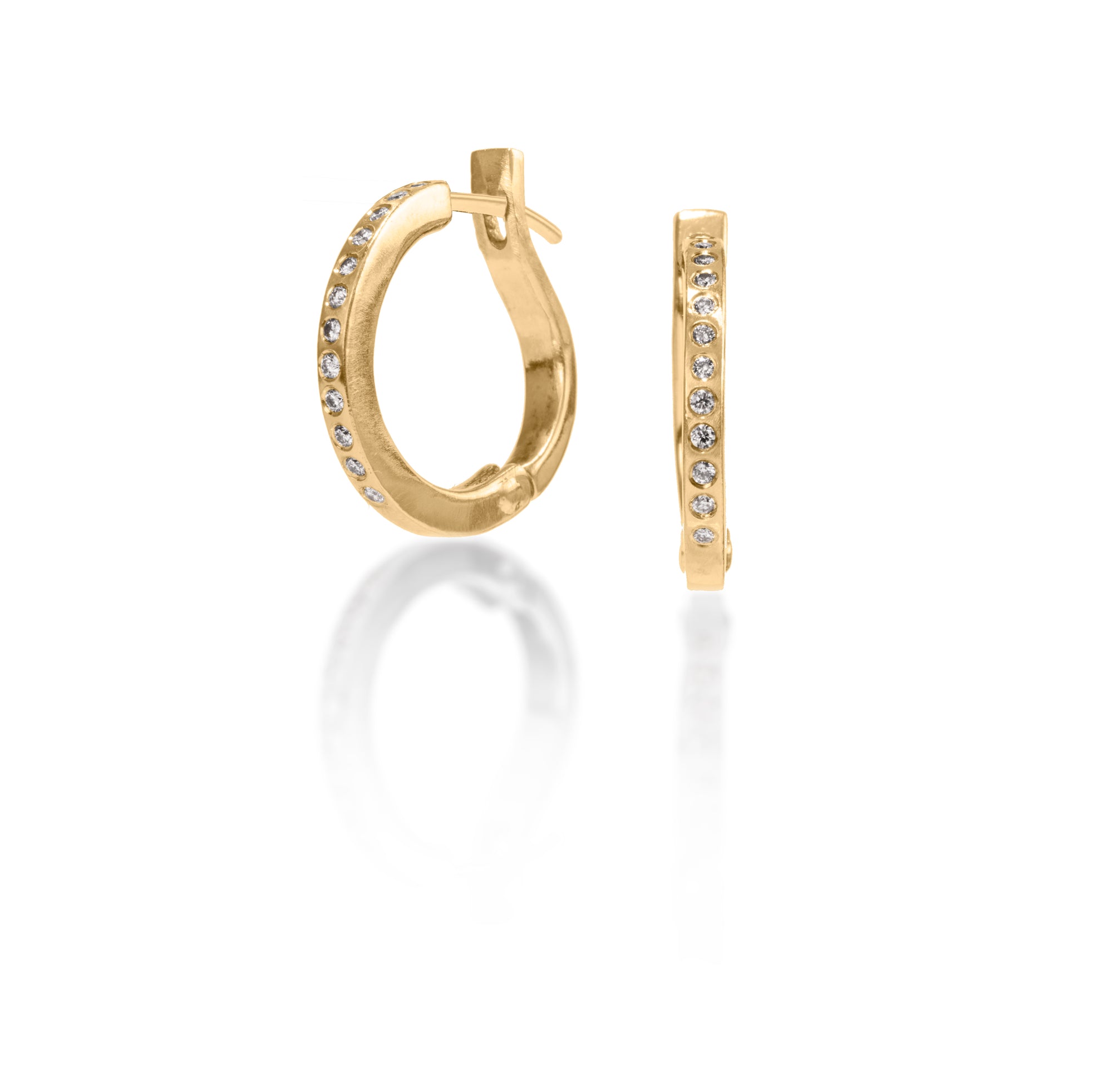 These simple, but elegant hoops are great on their own or accented with gem as a drop earring.  They feature white diamonds, 0.1656 tcw., and a built in closure that snaps securely closed.  Available in four color ways, oxidized silver, 18k gold, palladium or platinum.