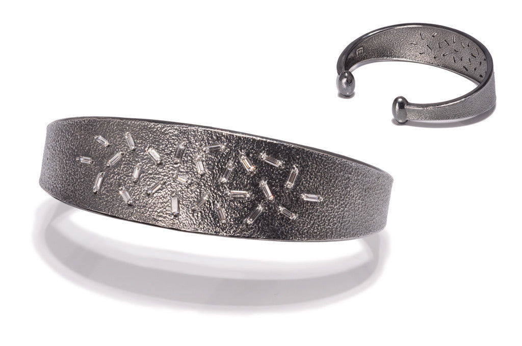 Ice bracelet #1, a cuff style bracelet in oxidized sterling set with 25 white diamond baguettes. Richly textured, .7697 tcw.
