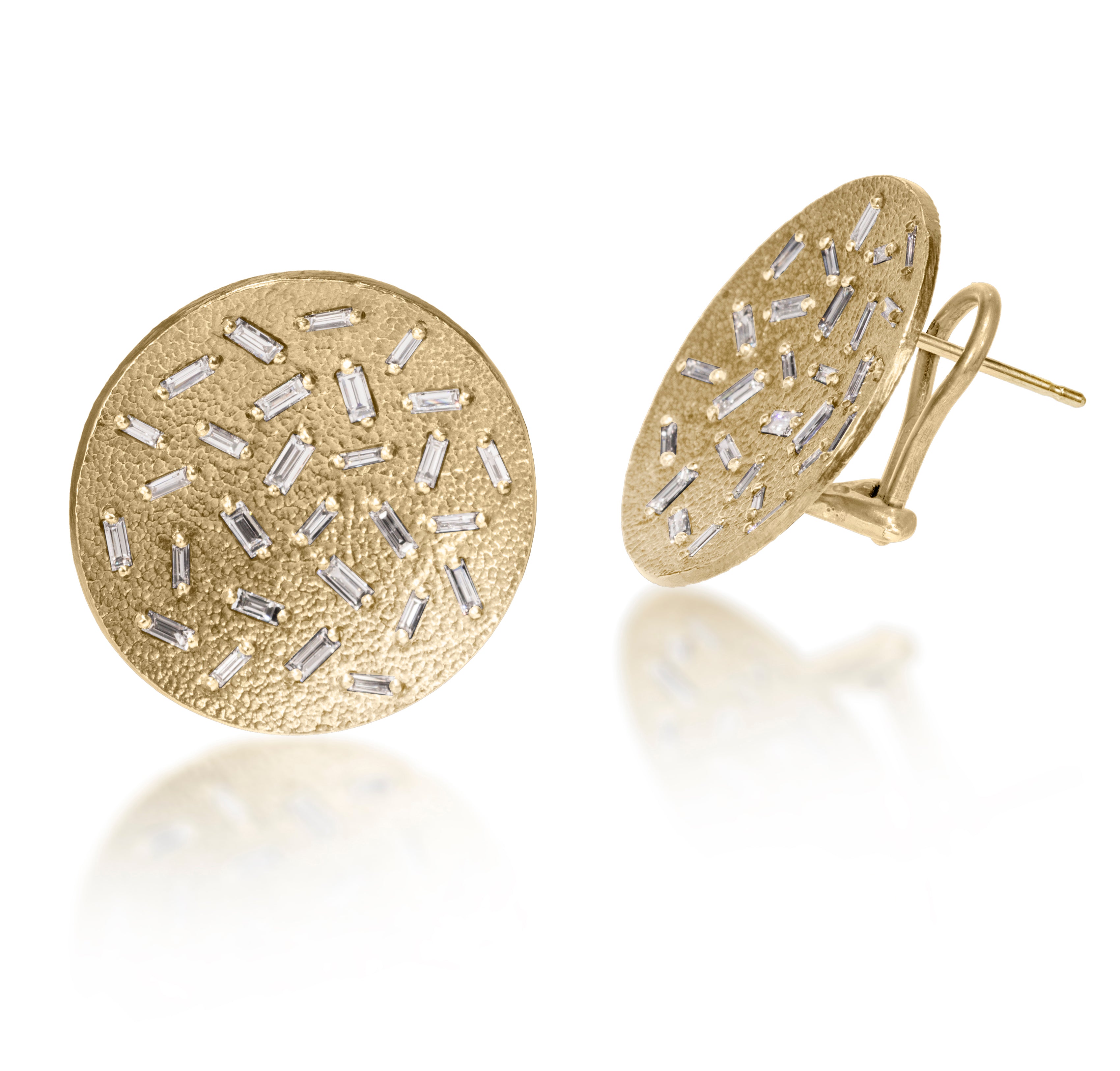 This simple but dramatic post earring is perfect for everyday or a fabulous night out.  Offered in three richly textured color ways, oxidized sterling, 18k gold, palladium.  Each earring set with 28 white diamond baguettes.  18k post features an omega back for added support. 1.546 tcw.