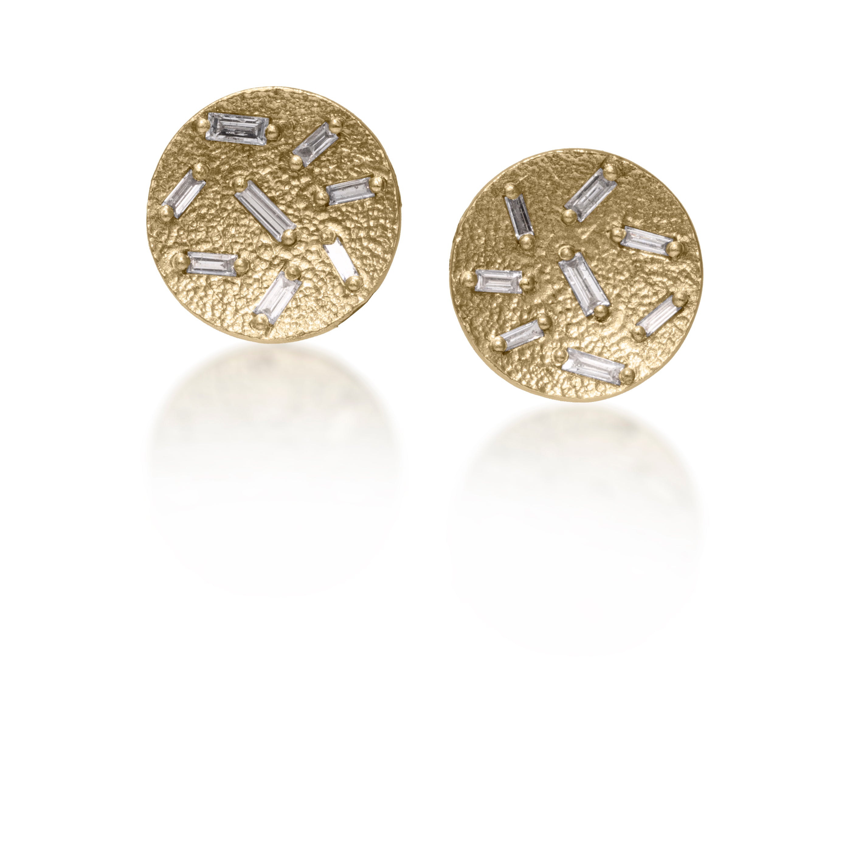 This simple yet elegant post earring is perfect for everyday.  Offered in three richly textured color ways, oxidized sterling, 18k gold, palladium.  Each earring is set with 8 white diamond baguettes. 0.454 tcw.