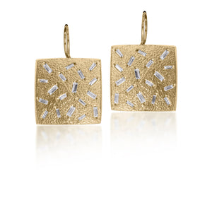 This medium size, simple but dramatic post earring is perfect for everyday or a fabulous night out.  Offered in three richly textured color ways, oxidized sterling, 18k gold, palladium.  Each earring set with 18 white diamond baguettes.  0.972 tcw.