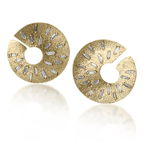 The smaller of two radiant styled earrings, each set with 21 white diamond baguettes. Richly textured and designed to three dimensionally wrap around from the front to behind the ear.  It is available in three color ways, oxidized silver, 18k gold and palladium.  1.176 tcw.