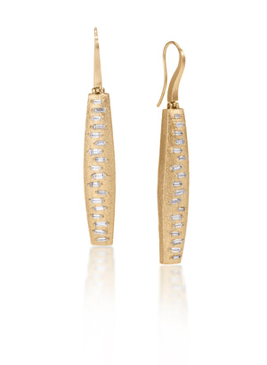 This earring features a hinged earwire, with a graceful, curved and tapered form. The playful irregularity of the baguette angles catch the light in dynamic ways. Design is offered in four richly textured colorways, oxidized sterling, oxidized sterling/18k gold, 18k gold and palladium.  Each earring set with 36 total white diamond baguettes. 1.1104 tcw.