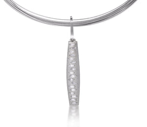 This hinged pendant features a graceful, curved and tapered form. The playful irregularity of the baguette angles catch the light in dynamic ways when worn. Design is offered in four richly textured color ways, oxidized sterling, oxidized sterling/18k gold, 18k gold and palladium. 0.555 tcw.