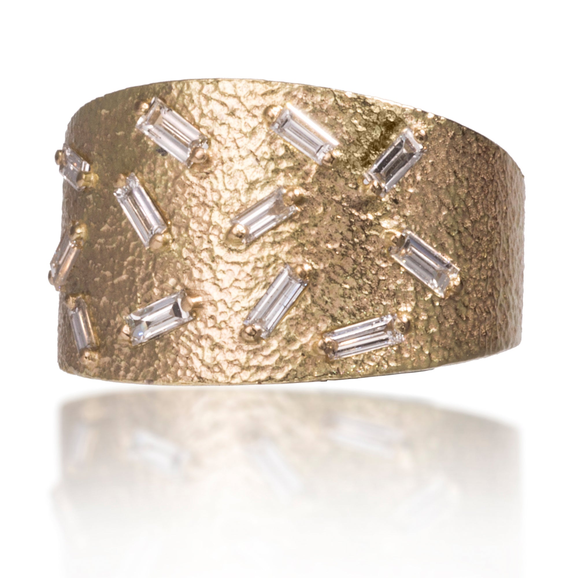 This medium width cigar band style ring is set with 12 white diamond baguettes. It is available in three richly textured color ways, oxidized silver, 18k gold, and palladium. Makes a beautiful bridal alternative. 0.4023 tcw. 