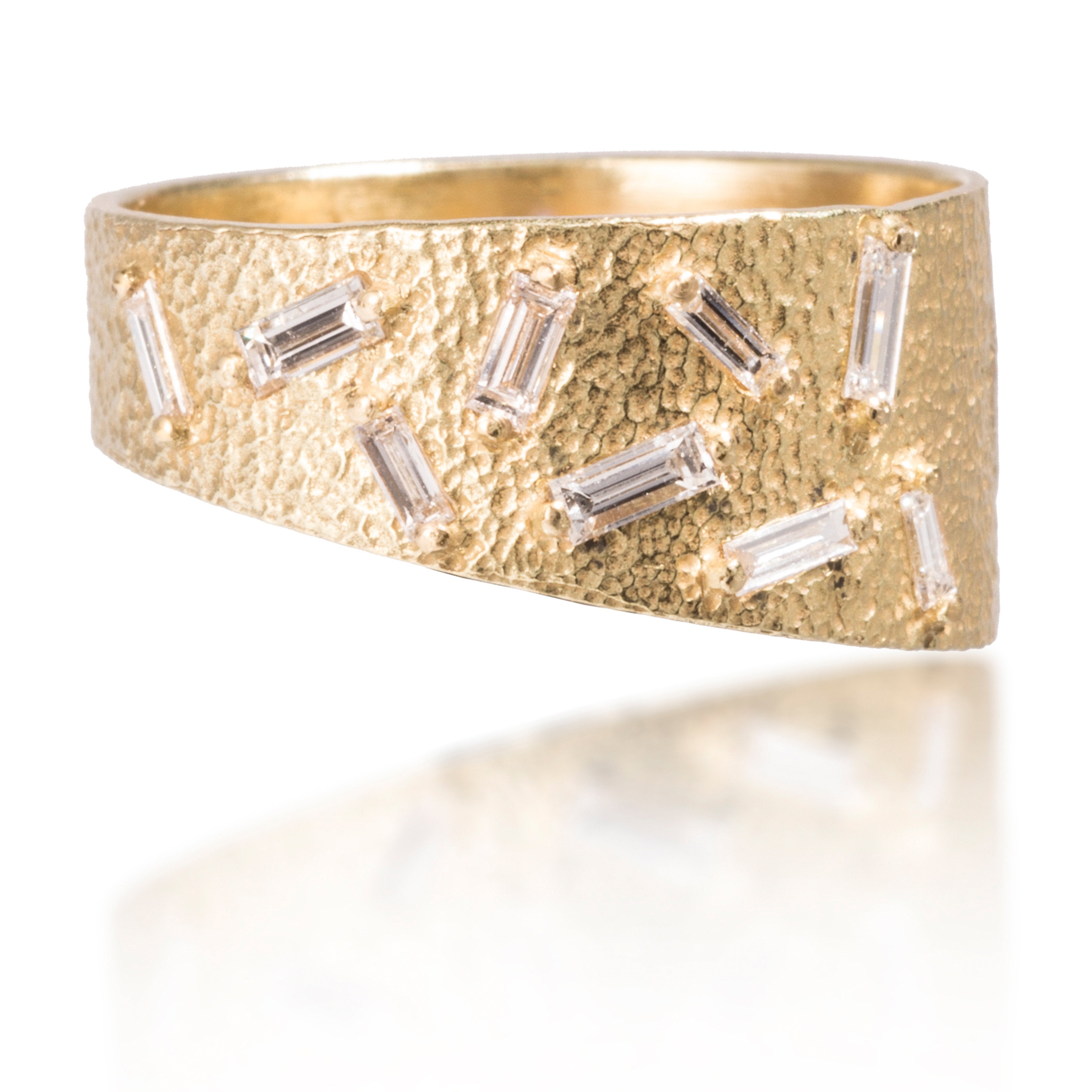 This stackable ring is set with 9 white diamond baguettes. It is available in four richly textured color ways, oxidized silver, 18k gold, palladium and platinum. 0.2798 tcw.