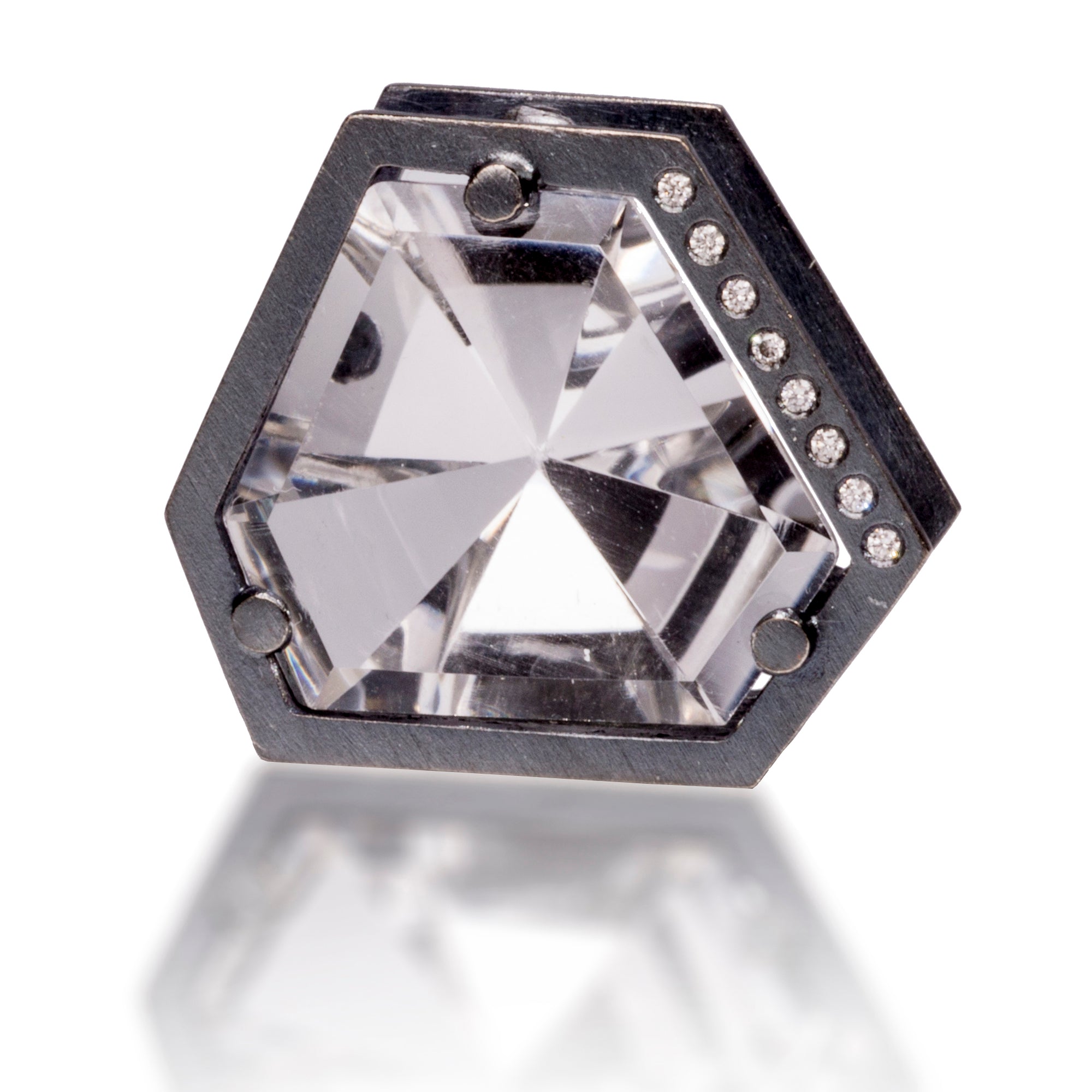 This custom cut, angular quartz pendant is set with an oxidized silver frame and posts, flush set with color matched diamonds. Quartz gem, 12.5 tcw, Diamonds, 0.058 tcw.