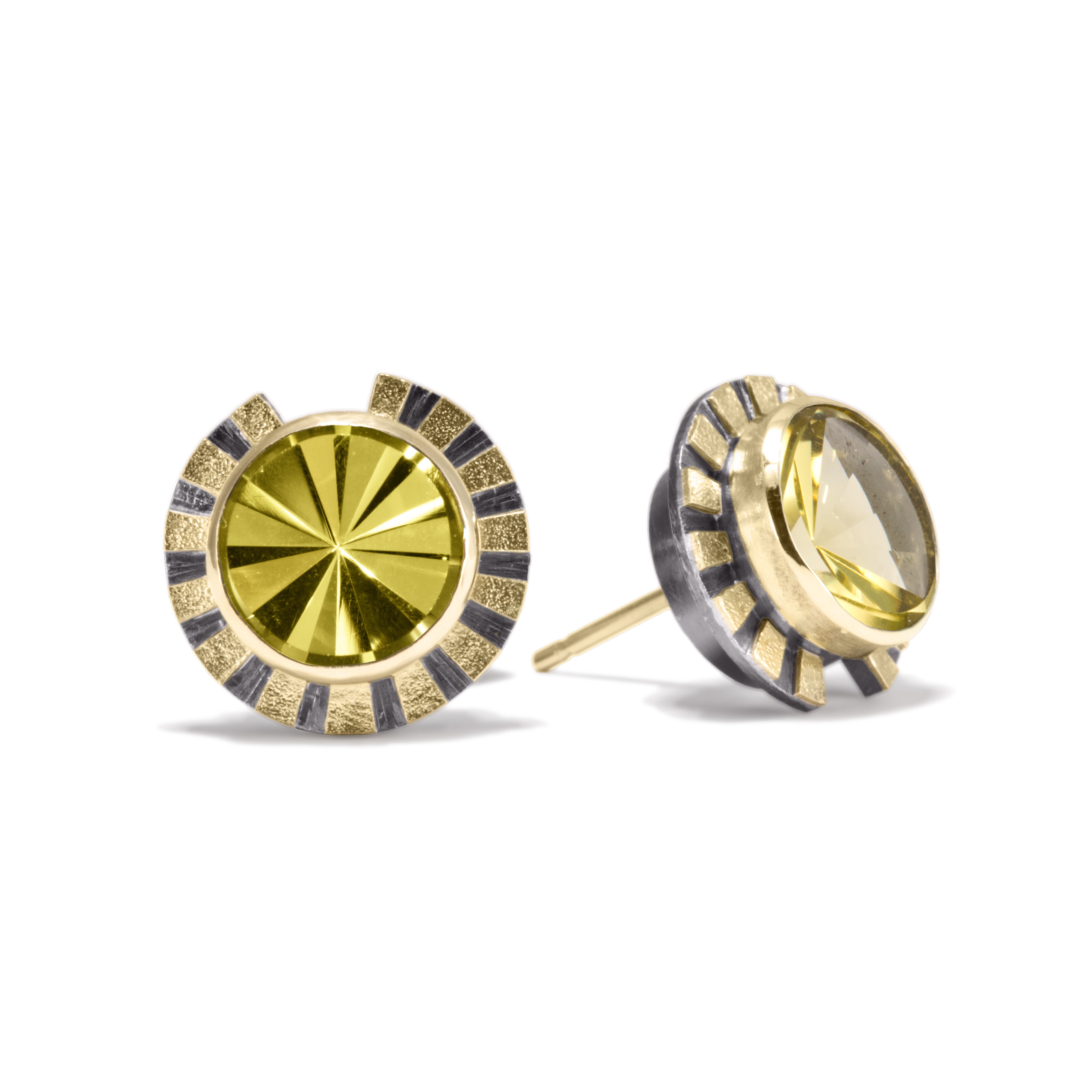 This is the refined and dazzling Striped Earring #1. Made in 18k gold and oxidized sterling silver, the design features a bezel set, radial cut, semiprecious center stone. Hand fabricated, stipple textured and engraved mixed metals.  Available in seven color ways, with 14k gold posts.