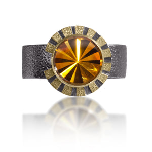 Stripe Ring #1 in 18k gold and oxidized sterling silver with a bezel set radial cut,  semiprecious center stone. Hand fabricated, stipple textured and engraved mixed metals. Textured band with rounded “comfort” contour.