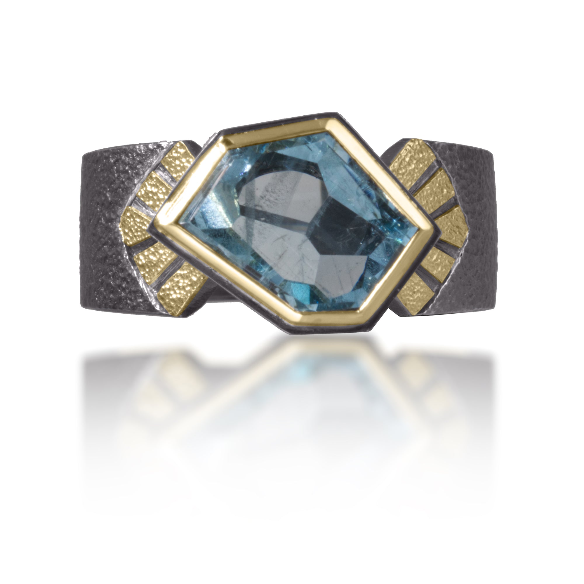 Stripe Ring #6 in 18k gold and oxidized sterling silver with a bezel set, one of a kind, angular aquamarine gem, 2.06 tcw. Hand fabricated, stipple textured and engraved mixed metals. The band measures 9mm at the widest point, narrowing to 5.5mm in the back.