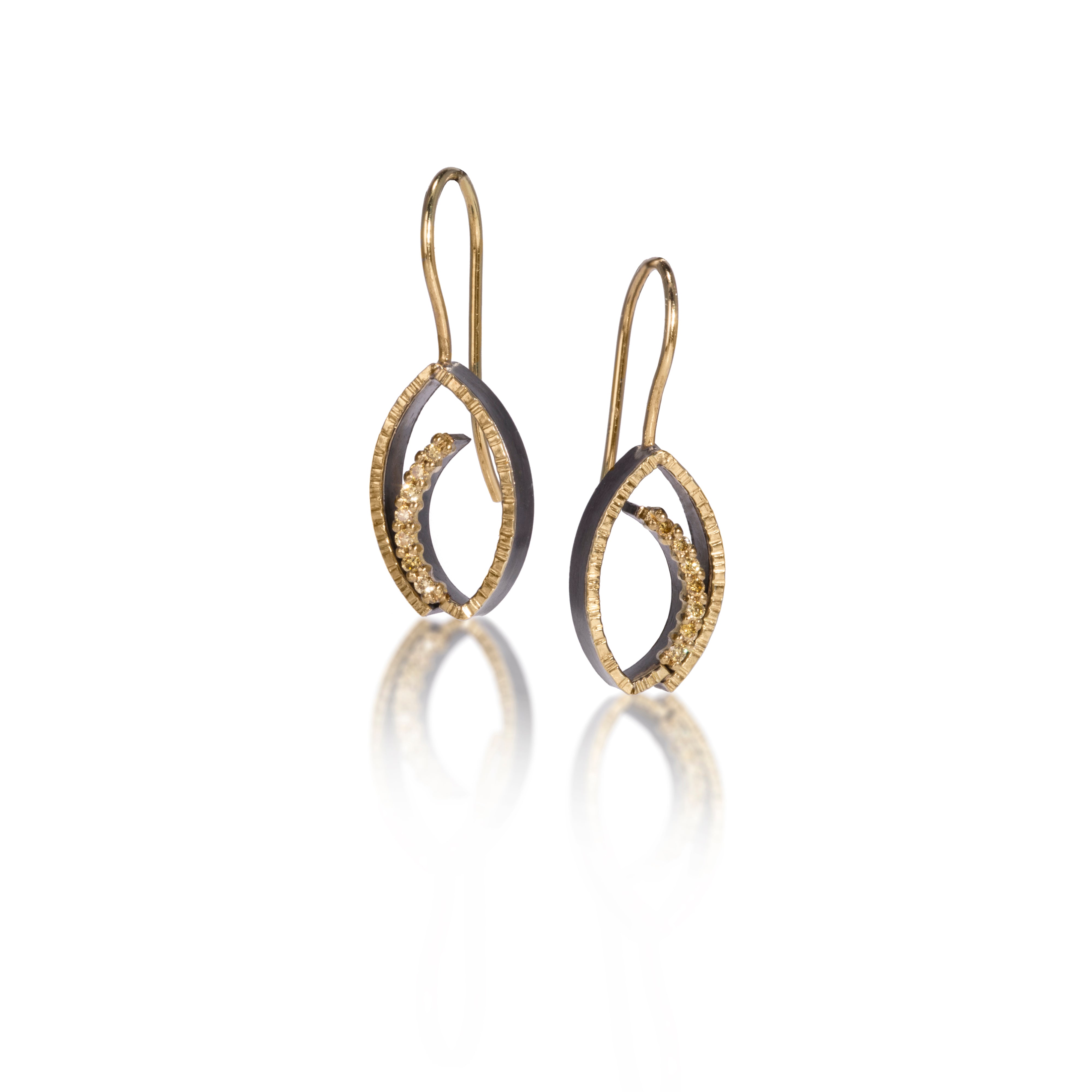 Tempest Earring #3, size small in 18k gold and oxidized sterling silver with prong set natural yellow diamonds. 18k earwire with closure. Forged, textured and fabricated by hand. 0.1008 tcw.