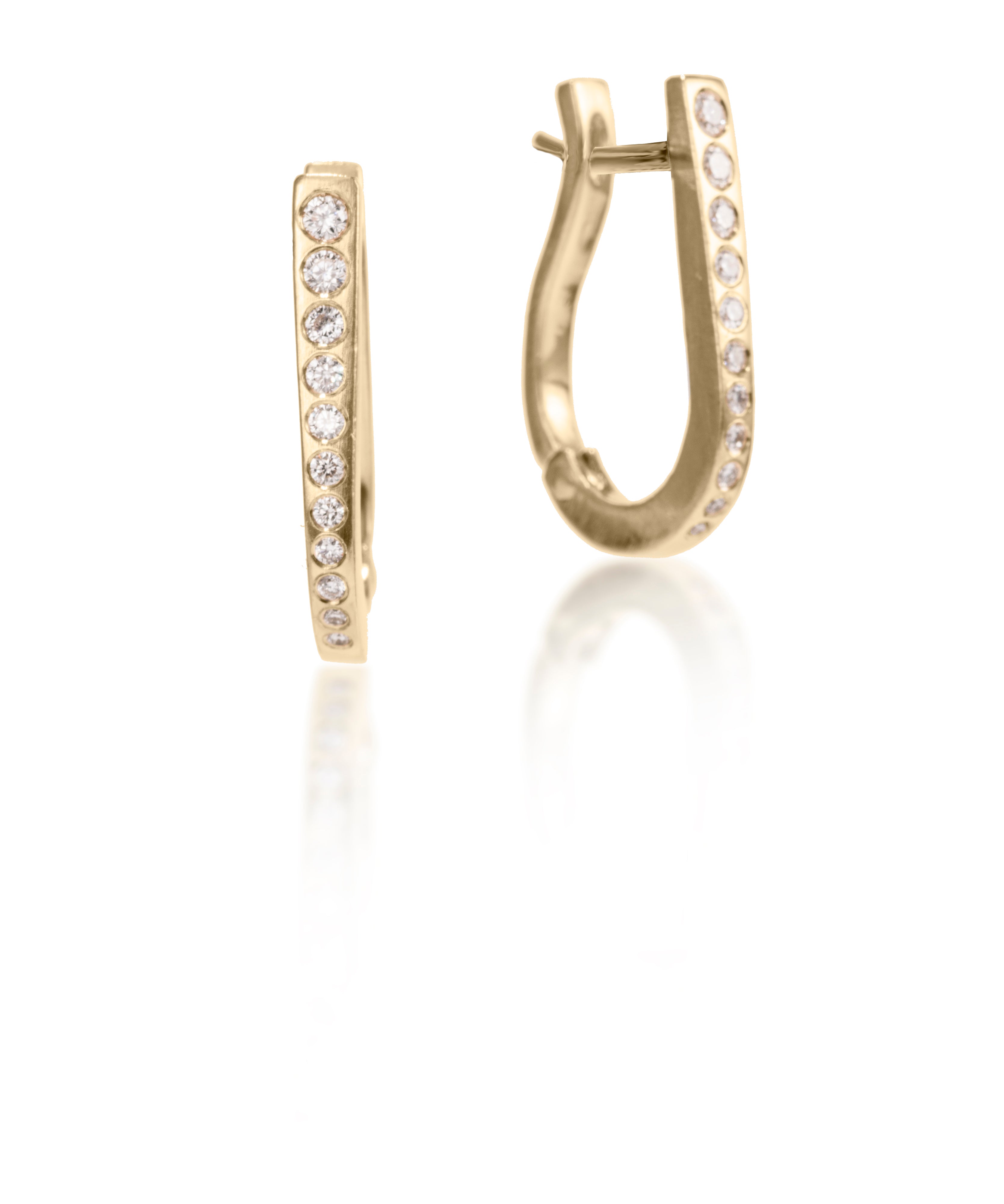 These simple, but elegant horseshoe shaped hoops are great on their own or accented with gem as a drop earring.  They feature cascading white diamonds, 0.318 tcw., and a built in closure that snaps securely closed.  Available in four color ways, oxidized silver, 18k gold, palladium or platinum.